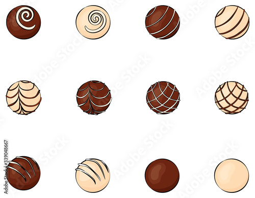 Round chocolates with different decor  isolated on white