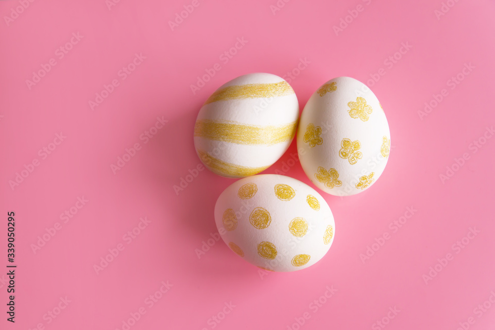 colorful easter eggson pink background