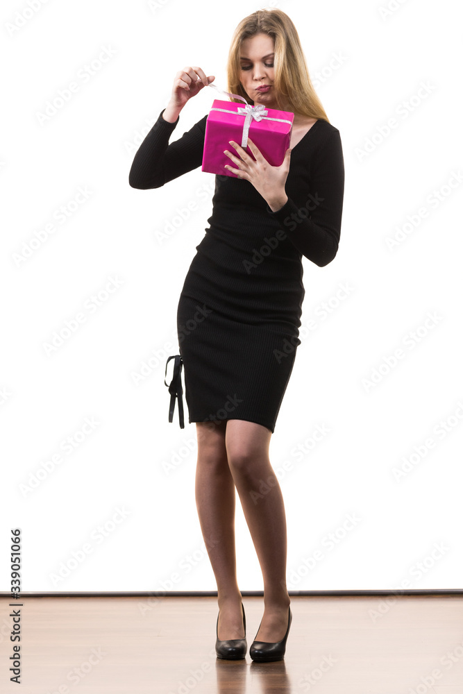 Fototapeta premium Girl opening pink gift box