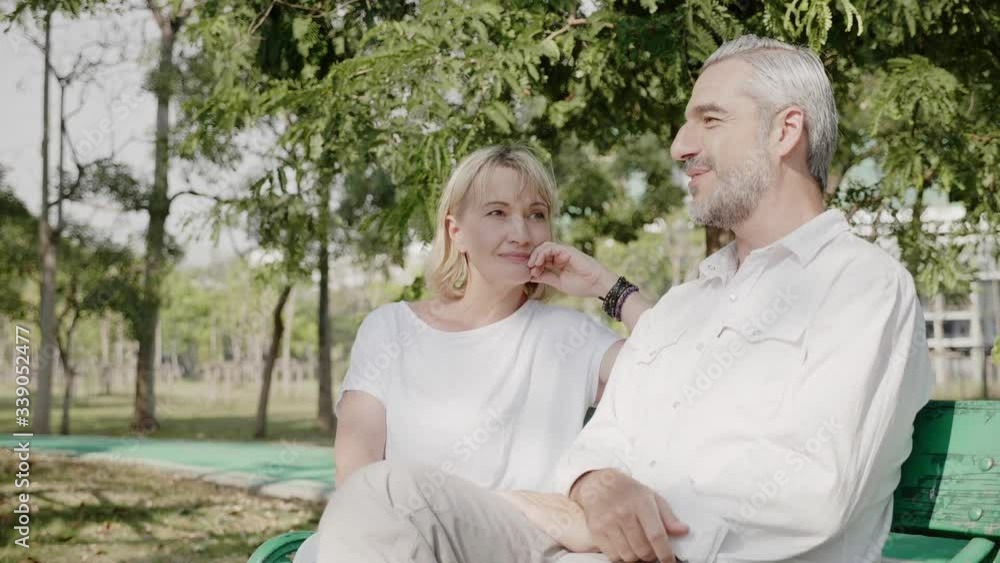Caucasian family couple Elderly men and women sitting and talking Happy in the garden In summer. Holiday activities Living together in retirement. Old age health care. international day of families Caucasian family couple Elderly men and women sitting and talking Happy in the garden In summer. Holiday activities Living together in retirement. Old age health care. international day of families