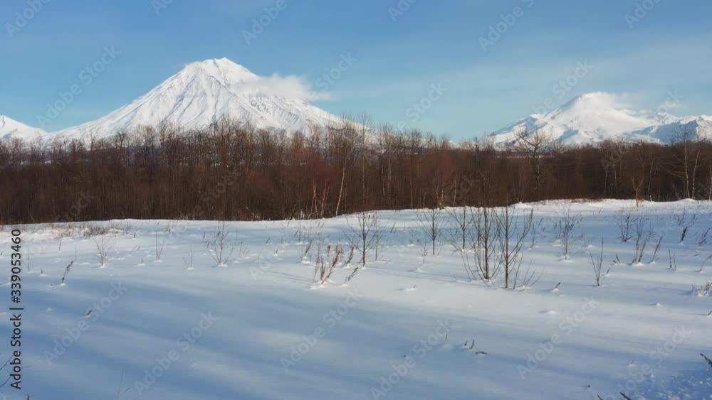 Kamchatka's home volcanoes tower over the city of Petropavlovsk-Kamchatsky. Taken in winter from a quadrocopter Kamchatka's home volcanoes tower over the city of Petropavlovsk-Kamchatsky. Taken in winter from a quadrocopter