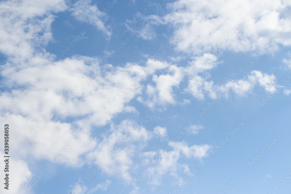 Beautiful Altocumulus clouds on the blue sky during spring sunny day. Theme of beautiful landscapes. Beautiful Altocumulus clouds on the blue sky during spring sunny day. Theme of beautiful landscapes.