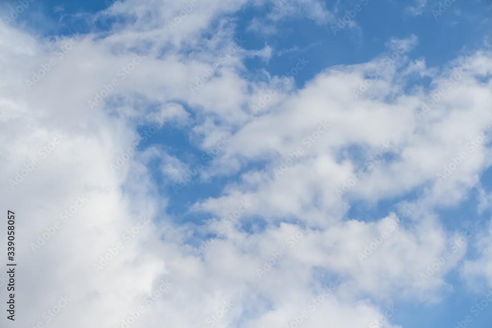 Beautiful Altocumulus clouds on the blue sky during spring sunny day. Theme of beautiful landscapes. Beautiful Altocumulus clouds on the blue sky during spring sunny day. Theme of beautiful landscapes.