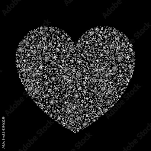 Isolated doodle lacy heart from many hand drawn white contours of abstract flowers and leaves on a black background. Beautiful romance vector element for for design, greeting card, banner.