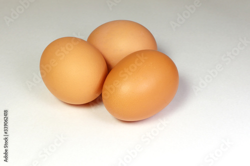 Chicken eggs on a white background. Brown eggs