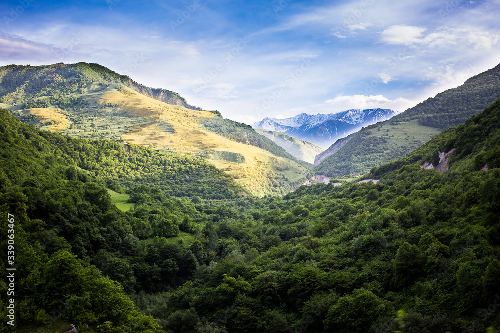 Mountains rocks a relief a landscape a hill a panorama Caucasus top a slope clouds the sky a landscape Mountains rocks a relief a landscape a hill a panorama Caucasus top a slope clouds the sky a landscape