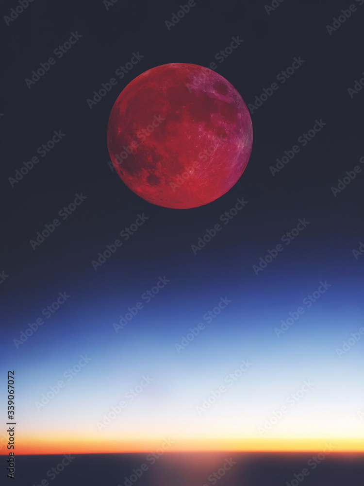 Fototapeta premium Full red bloody Moon setting / rising above the horizon.