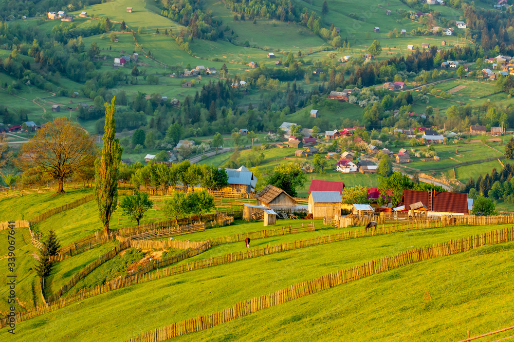 View of small town among green hills
