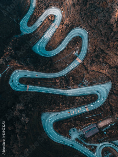 Aerial view of winding road from high mountain pass in Malaysia.