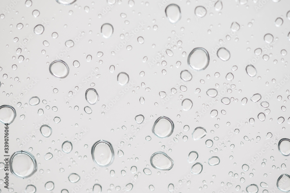Rain drops on window glasses surface Natural Pattern of raindrops. Natural pattern of raindrops on white background for your design. Rain drops on window glasses surface Natural Pattern of raindrops. Natural pattern of raindrops on white background for your design.