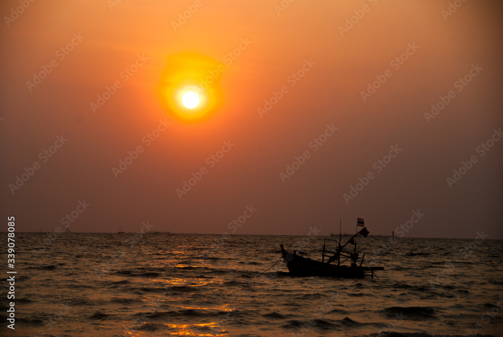 A boat on the sea at sunset