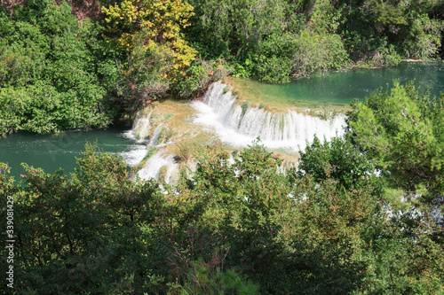 Breathtaking view Waterfalls of Krka National Park, Sunny day, summer season having greenery and trees, Croatia © Khurram
