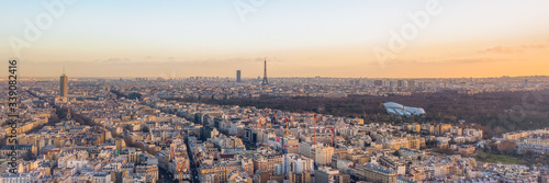 Aerial panorama drone shot of districts Neuilly sur Seine in Paris with Tour Eiffel Montparnasse Jardin acclimatation in Boulogne forests