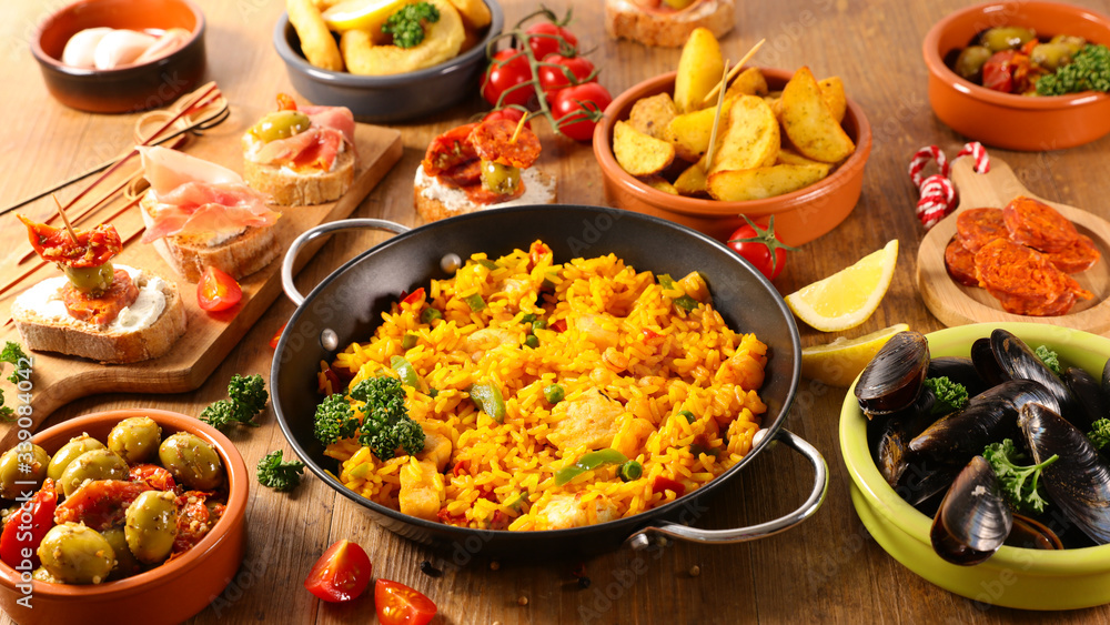 assorted of spanish dish- paella, tapas, olive, patatas bravas Stock