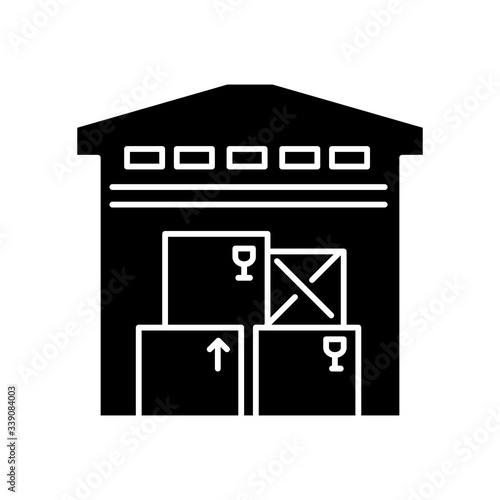 Warehousing black glyph icon. Merchandise storage, storehouse building, stockroom exterior. Industrial premises, factory floor. Silhouette symbol on white space. Vector isolated illustration