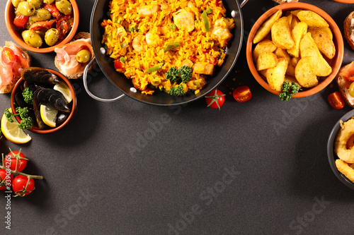 assorted of spanishfood with paella and tapas photo