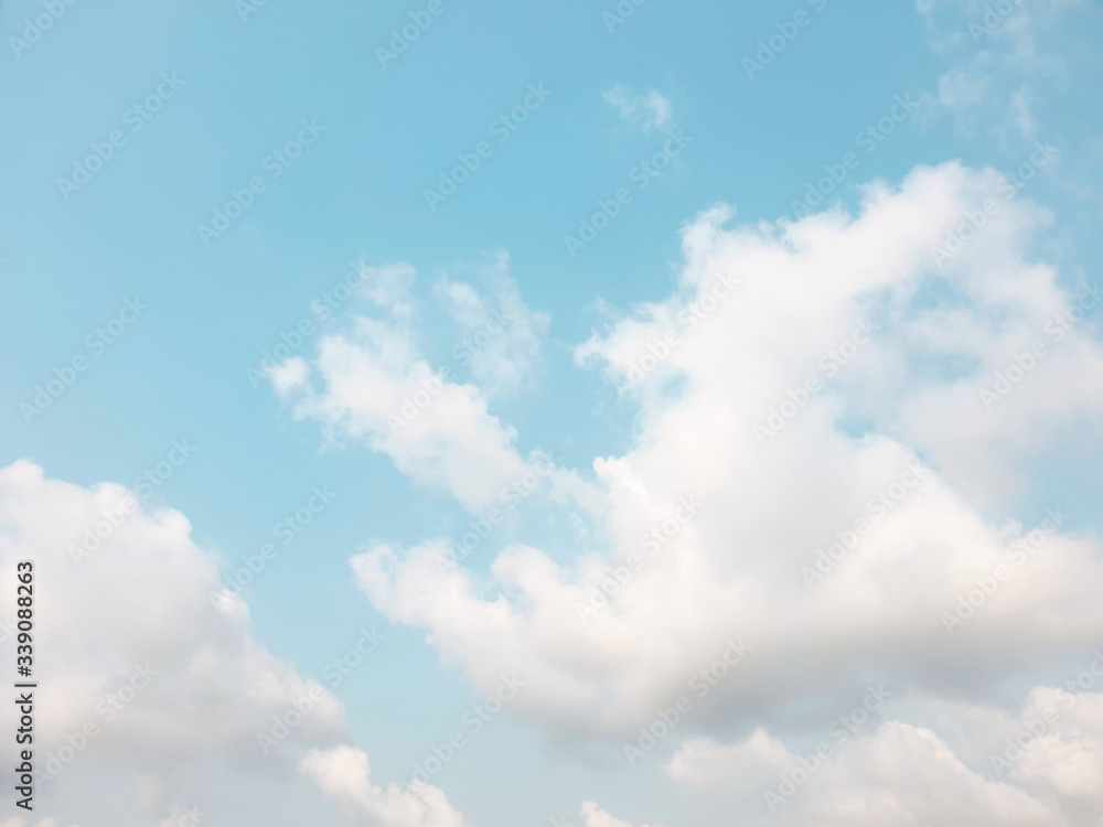Large clouds floating in the blue sky.The weather is clear today.subtle background Large clouds floating in the blue sky.The weather is clear today.subtle background