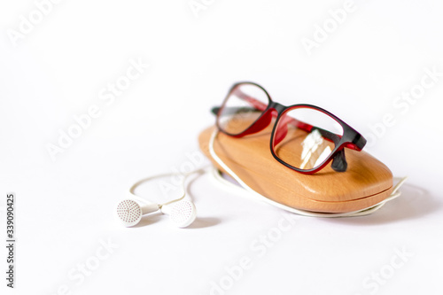 eyeglass placed on its wooden case