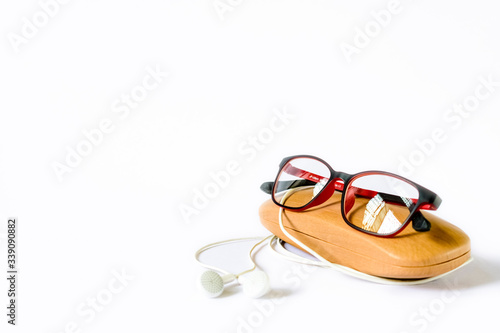 eyeglass placed on its wooden case