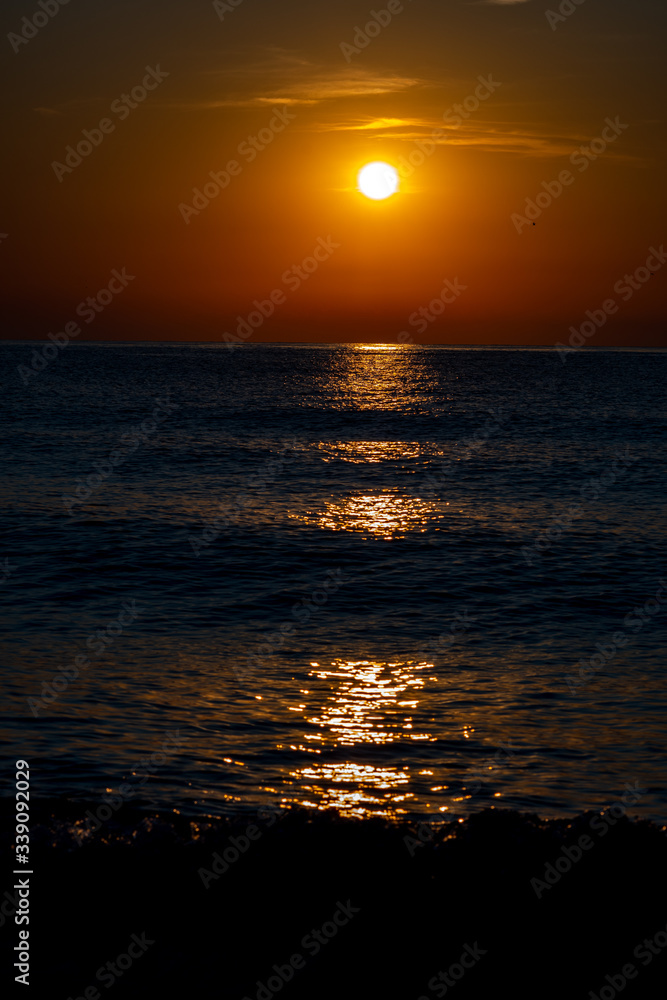 Fototapeta premium the sun reflected at sea at sunrise