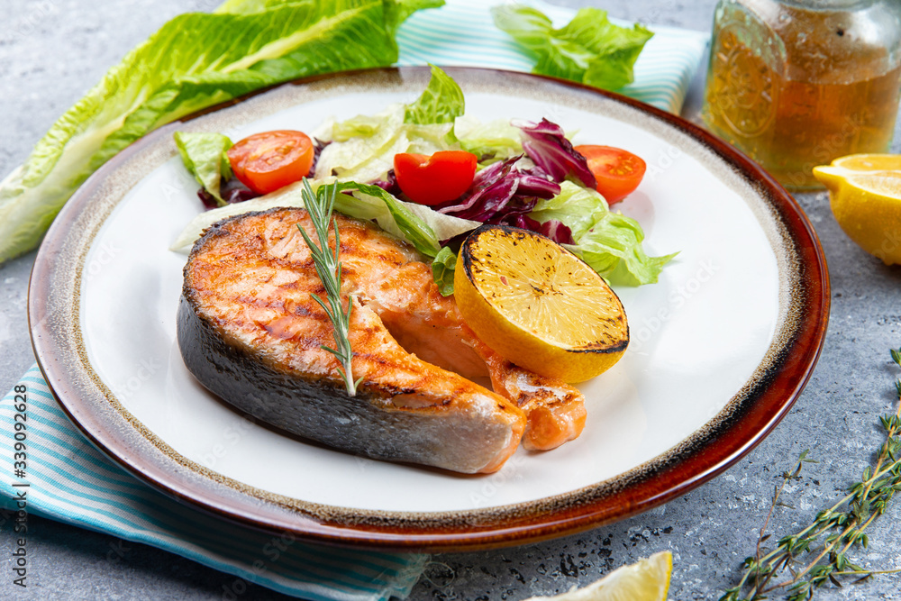 salmon steak and salad with tomatoes salmon steak and salad with tomatoes