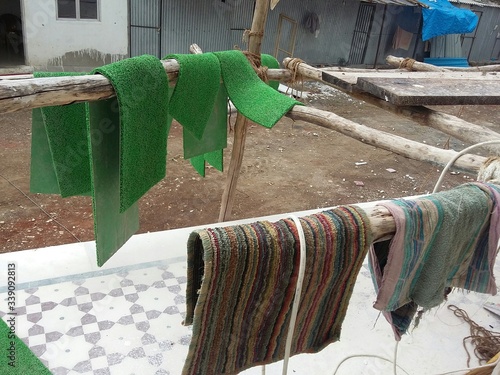 Obraz na płótnie Close-up Of Doormats Drying On Bamboos