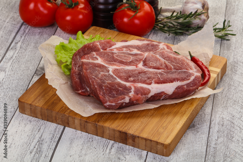 Raw pork neck steak