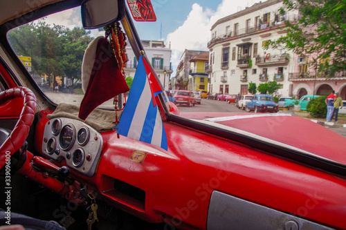 Classic car dashboard driving through the streets of havana