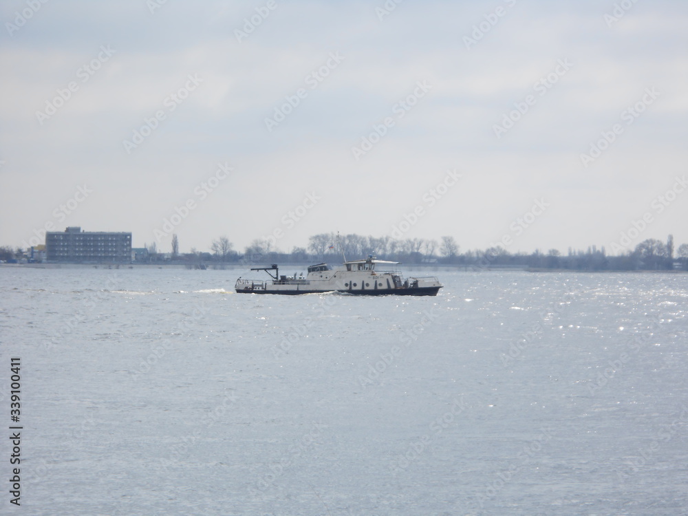Little factory's boat on the Volga river with a waves Little factory's boat on the Volga river with a waves