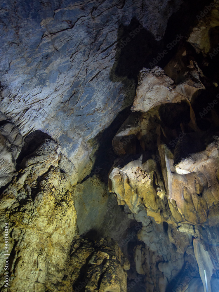 Cave Inner View and texture of the inner walls of a mountain cave with stalactites ...