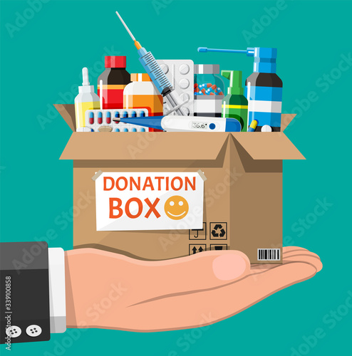 Cardboard box full of drugs in hand. Needed items for donation. Different pills bottles, healthcare, pharmacy. Medical drug vitamin, antibiotic. Donate, charity, thanksgiving. Flat vector illustration