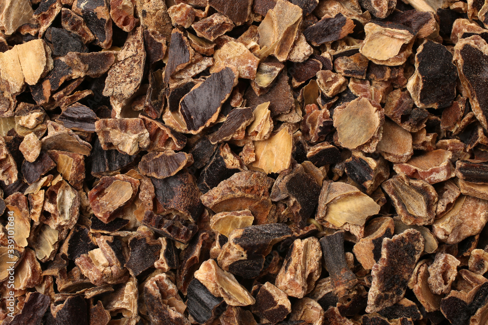 Raw carob kibble nibbles, for backgrounds or textures Raw carob kibble nibbles, for backgrounds or textures