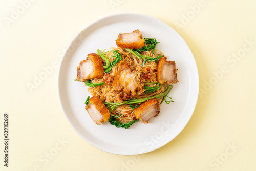 Stir-fried rice vermicelli and water mimosa with crispy pork belly