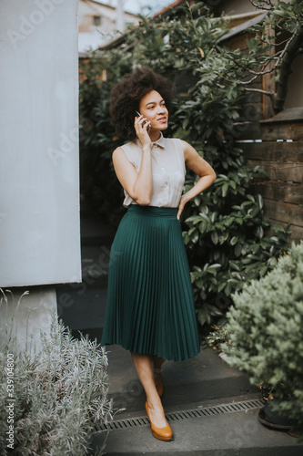 Young woman with a mobile p...