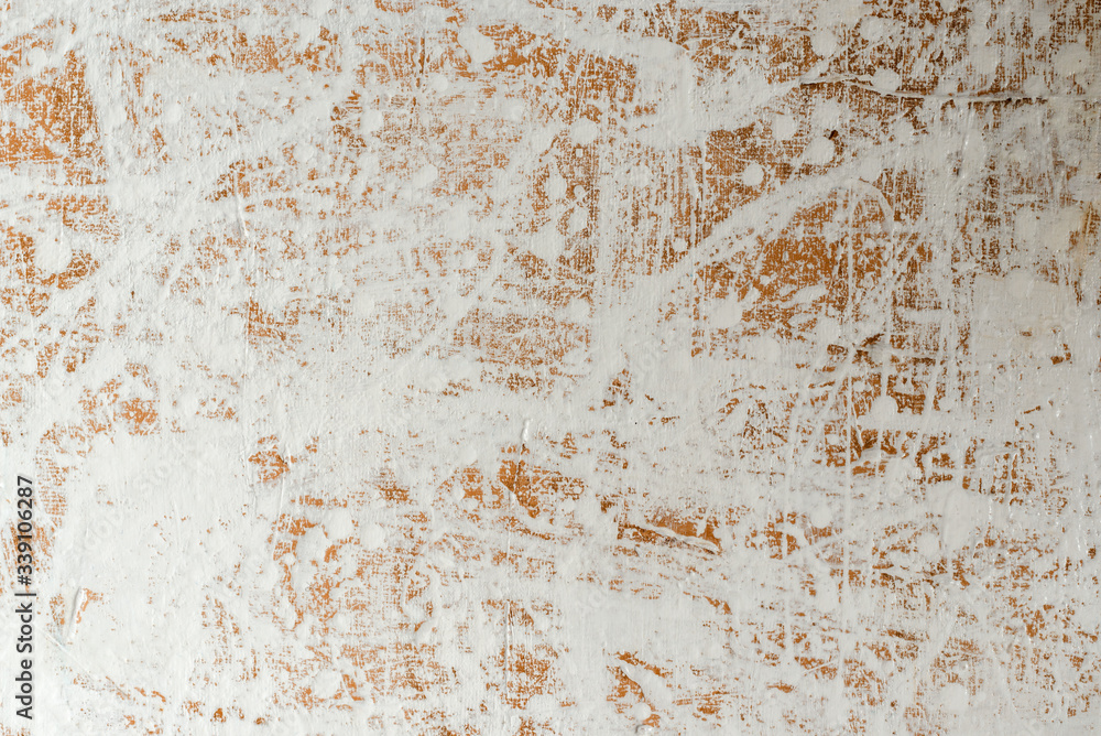 relief white-coffee background with a chaotic pattern of splashed white paint in daylight