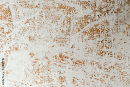 relief white-coffee background with a chaotic pattern of splashed white paint in daylight