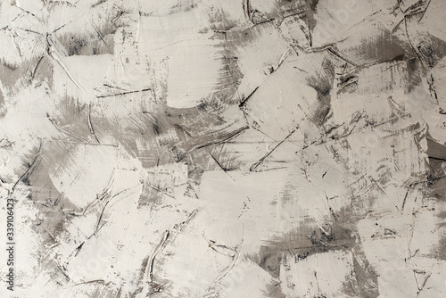 relief white-grey background with a pattern of grey and white paint in daylight