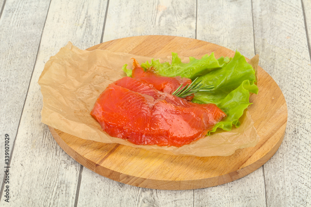 Sliced salmon fillet served rosemary Sliced salmon fillet served rosemary