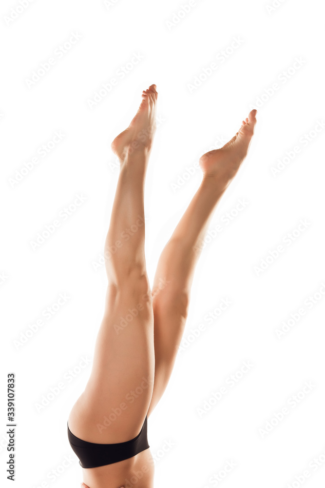 Beautiful female legs, butt and belly isolated on white background. Beauty, cosmetics, spa, depilation, treatment and fitness concept. Fit and sportive, sensual body with well-kept skin in underwear. Beautiful female legs, butt and belly isolated on white background. Beauty, cosmetics, spa, depilation, treatment and fitness concept. Fit and sportive, sensual body with well-kept skin in underwear.