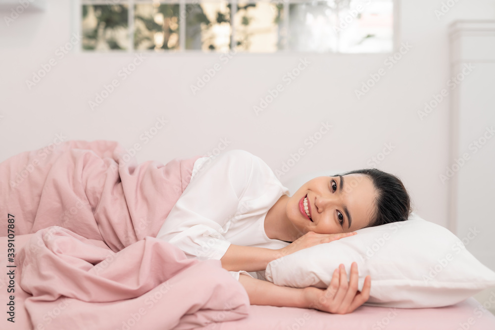Awakening from sleep happy woman in bed and soft pillow blanket Awakening from sleep happy woman in bed and soft pillow blanket