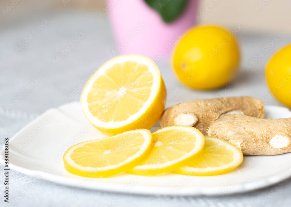 Ginger and lemon on a plate. Increased immunity. Natural vitamins. Close-up
