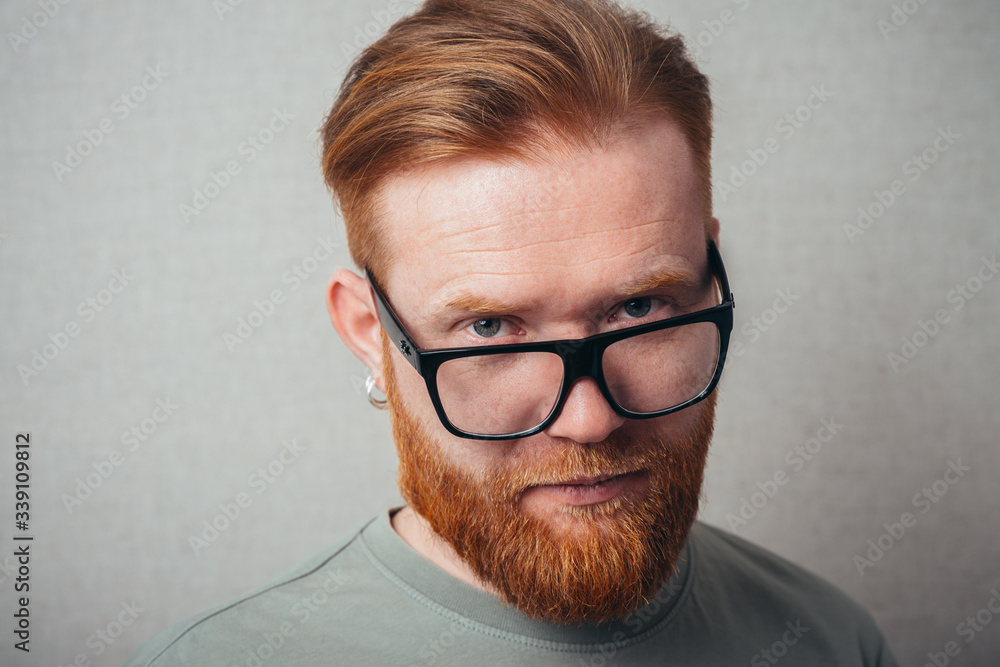 portrait of a bearded man with glasses