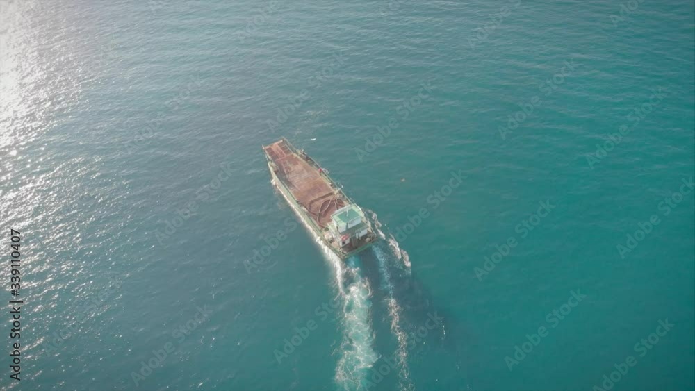 Aerial view little cargo ship of business logistic transportation sea freight,Cargo ship, Trade Port / Shipping. Aerial view little cargo ship of business logistic transportation sea freight,Cargo ship, Trade Port / Shipping.