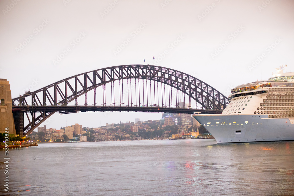 Obraz premium Sydney Harbour Bridge and Cruise Ship located in Sydney, NSW, Australia. Australia is a continent located in the south part of the earth.