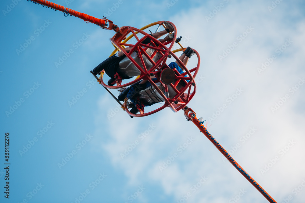 People having fun on a reversed bungee, also called slingshot ride.
