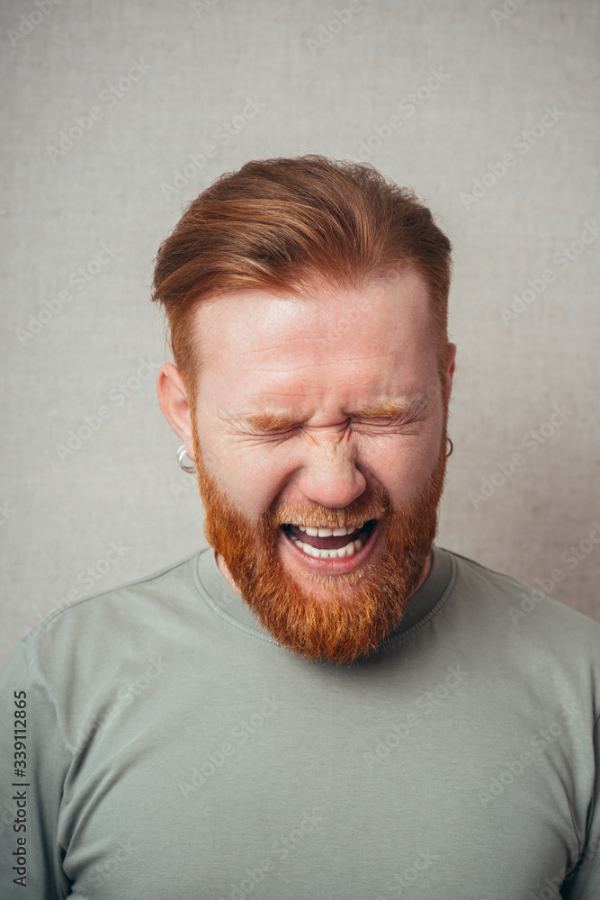 Portrait Of A Man Shouting On Grey Background Portrait Of A Man Shouting On Grey Background