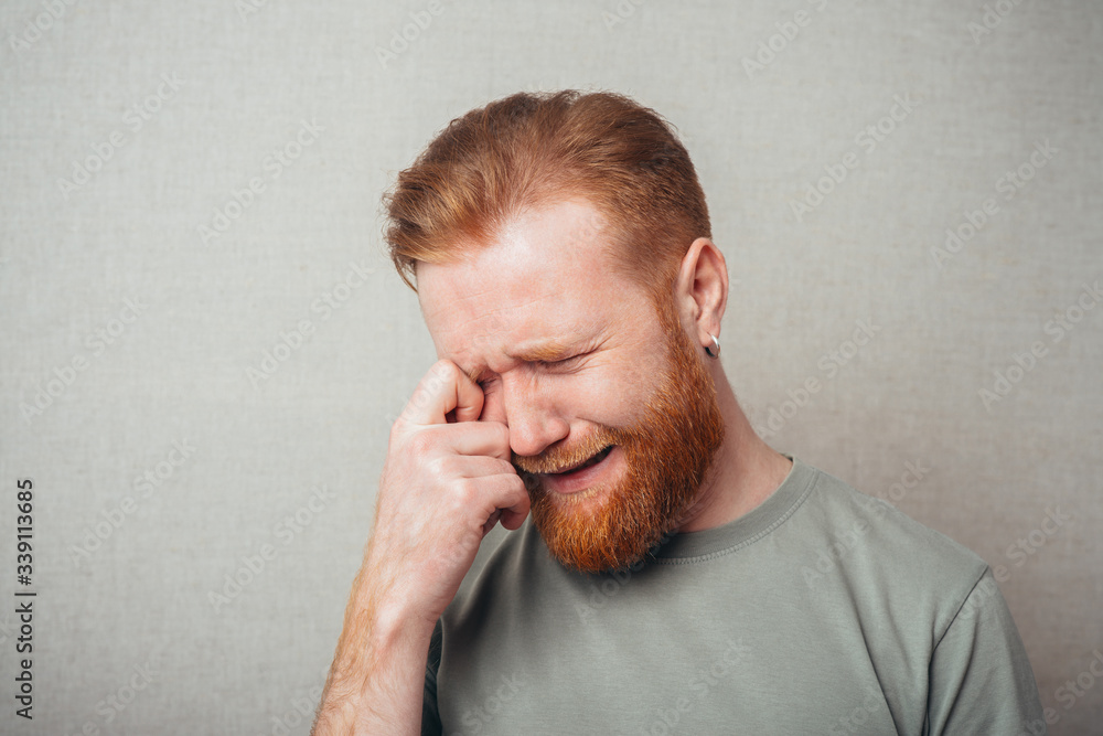 Emotional handsome Young hipster red bearded crying Emotional handsome Young hipster red bearded crying
