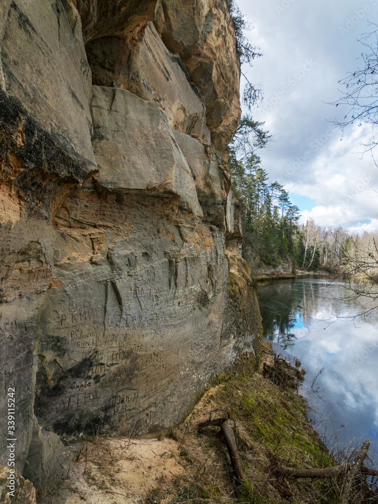 landscape with sandstone cliff on the river bank