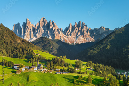 Famous alpine place Santa Maddalena village with magical Dolomites mountains in background, Val di Funes valley, Trentino Alto Adige region, Italy