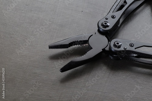 A multi-tool (or multitool) is a hand tool that combines several individual functions in a single unit.  photo